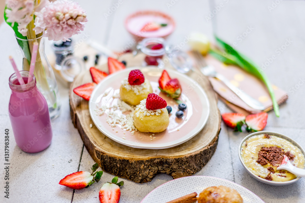 Fresh yoghurt and cake with strawberries and young spring flowers. Fresh yoghurt and cake with strawberries and young spring flowers.