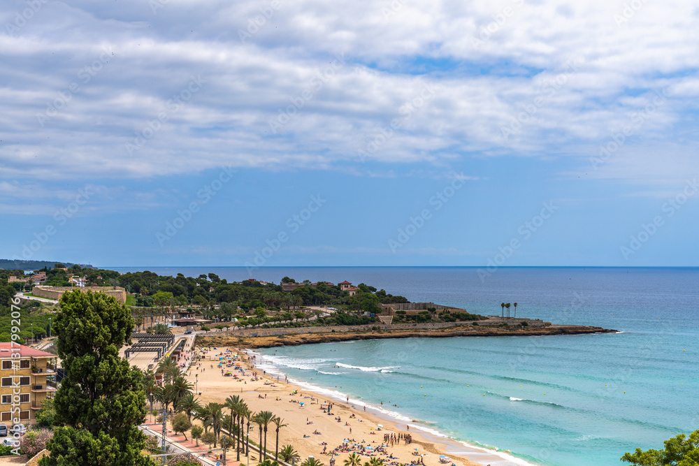 Beautiful panorama view of Balearic Mediterranean Sea and Playa El Milagro (Platja del Miracle) beach from the view platform near train station in summer in Tarragona, Catalonia, Spain Beautiful panorama view of Balearic Mediterranean Sea and Playa El Milagro (Platja del Miracle) beach from the view platform near train station in summer in Tarragona, Catalonia, Spain