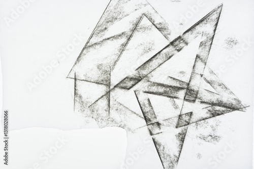 overlapping geometric triangle shape impressions on blank paper