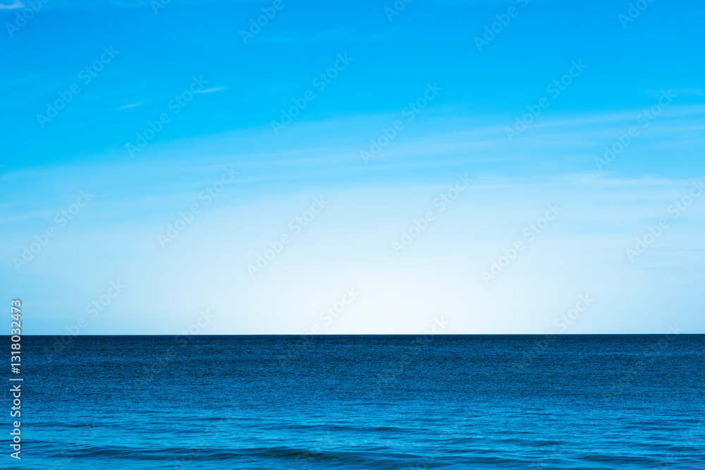 Obraz premium Nature of the beach and sea Summer with sunshine, sandy beaches, clear blue waters sparkling against the blue sky. On an island with good ecology and environment Background for summer vacation