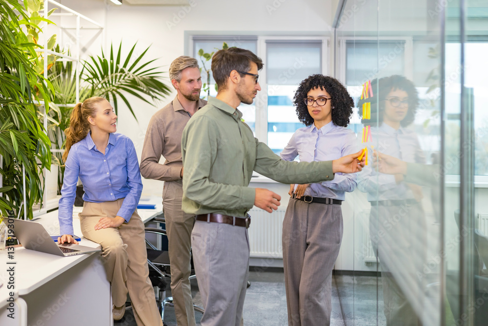 Obraz premium Creative group or business people planning innovation with sticky notes on glass wall.