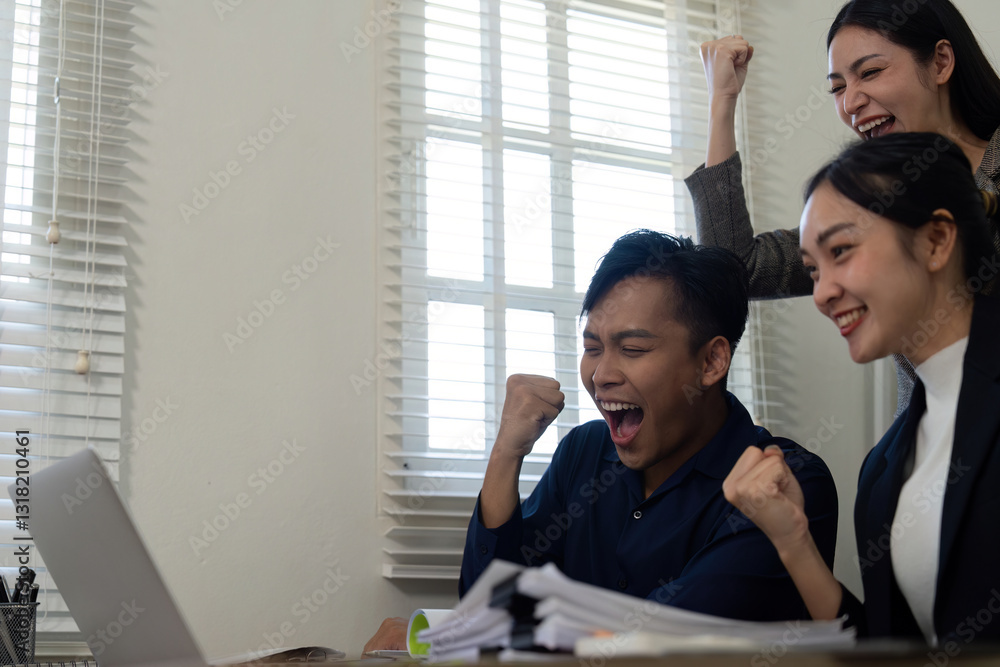 Celebrating success, a team rejoices after overcoming project challenges in the office. Celebrating success, a team rejoices after overcoming project challenges in the office.