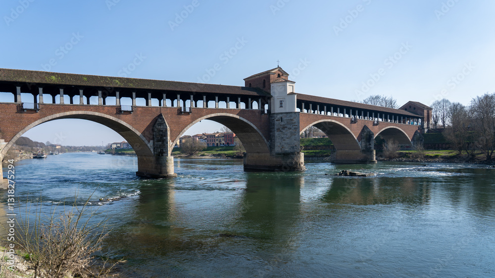 Pavia, Italy. Amazing view of the Ponte Coperto (Covered Bridge) or the Ponte Vecchio (Old Bridge) over the Ticino river Pavia, Italy. Amazing view of the Ponte Coperto (Covered Bridge) or the Ponte Vecchio (Old Bridge) over the Ticino river