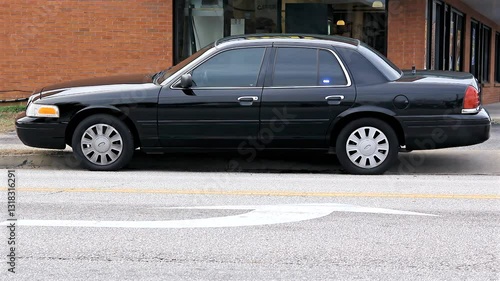Unmarked Black Police Car Parked Flashing Strobes