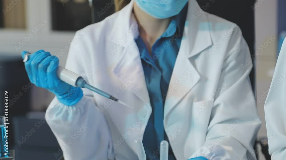 Scientist using microscope in laboratory. Close-up of a researcher's hands adjusting a modern microscope in a lab setting. Science concept Scientist using microscope in laboratory. Close-up of a researcher's hands adjusting a modern microscope in a lab setting. Science concept