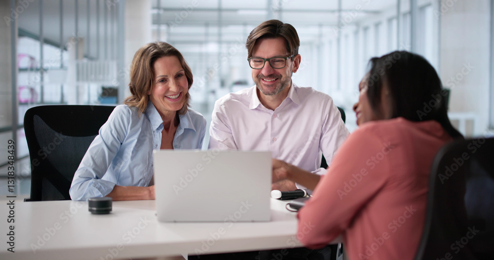Happy couple meets with tax accountant and financial planner Happy couple meets with tax accountant and financial planner