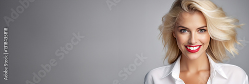 Attractive blonde Woman smiling broadly, portrait on Grey Background, space for text, banner