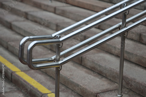 Stairway railing, close-up view of metal handrail on staircase. photo