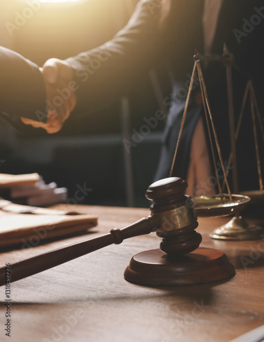 Attractive young lawyer in office Business woman and lawyers discussing contract papers with brass scale on wooden desk in office. Law, legal services, advice, Justice and real estate concept.