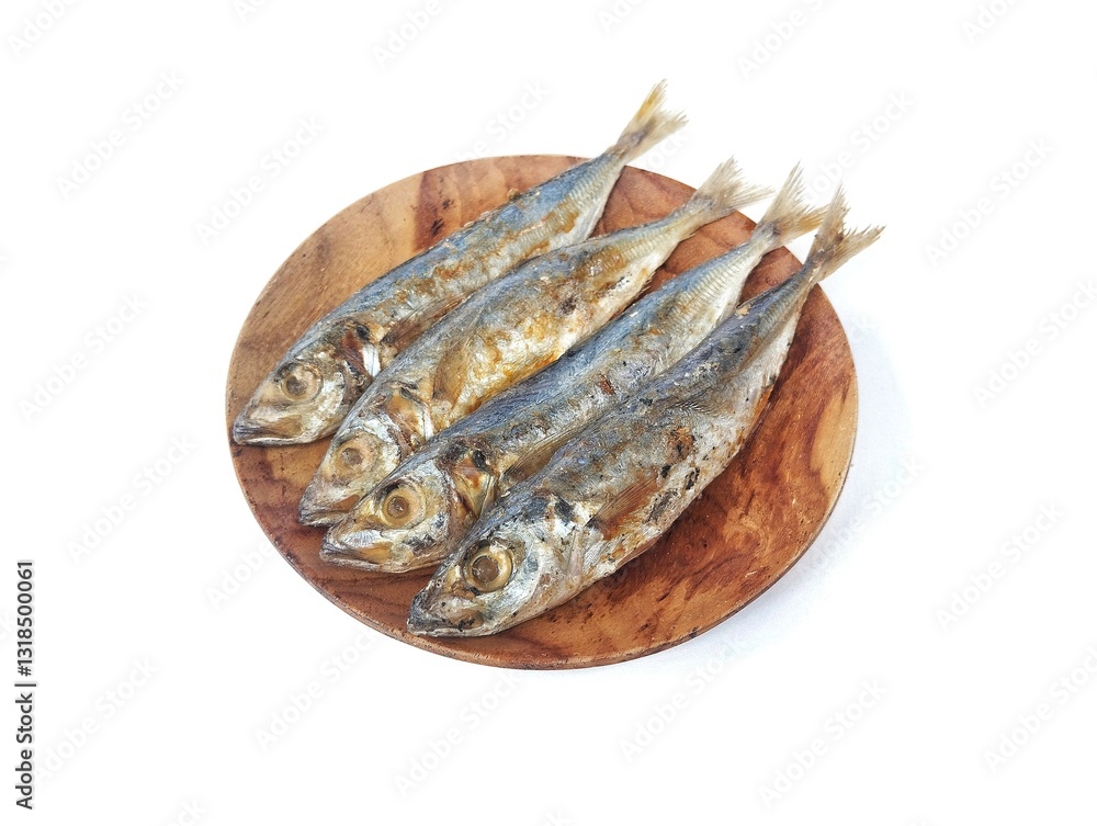 Dried salted fish on plate isolated on white background, Raw food, High angle view Dried salted fish on plate isolated on white background, Raw food, High angle view