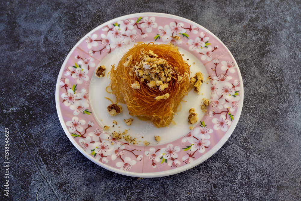 Close-up Turkish dessert kadayıf. Walnut filled kadayıf dessert