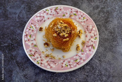 Obraz na płótnie Close-up Turkish dessert kadayıf. Walnut filled kadayıf dessert w salonie