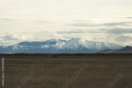Snow-Capped Peaks Beneath Vast Skies