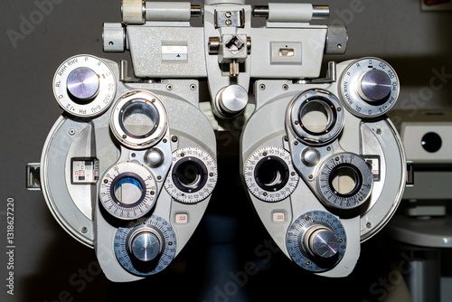 Close-up of a vintage phoropter used by optometrists to determine refractive error and prescribe eyeglasses or contact lenses.