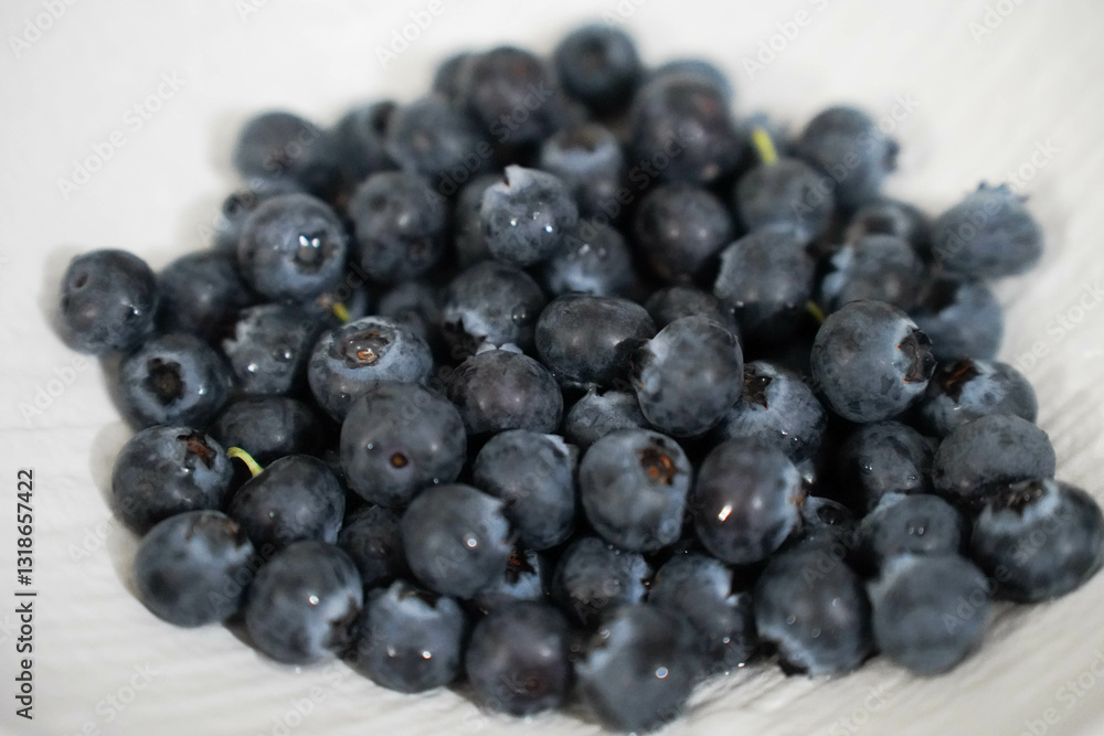 fresh blueberries on white plate