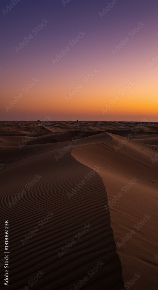 Naklejka premium Desert Sand Dune Landscape at Dusk with Warm Orange Sky