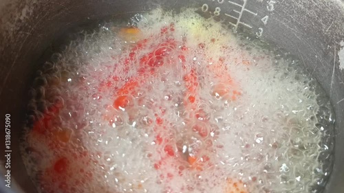 Boil the chilies and some other kitchen ingredients in a pan until the water boils.