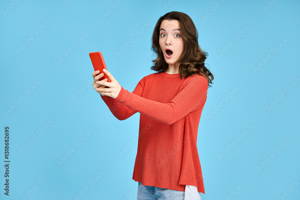 Excited young woman, girl student looking at the phone. Shock effect of news, messages, sale announcements received. Excited young woman, girl student looking at the phone. Shock effect of news, messages, sale announcements received.