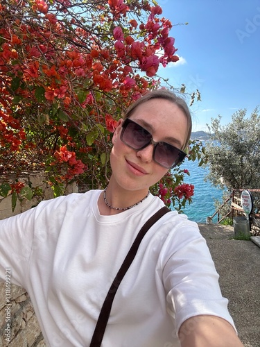 Coastal travel portrait of a woman by the sea, digital nomad and retreat vibe, blue water and island bay, summer vacation lifestyle, wellness slow travel and mindful escape, scenic background with cop