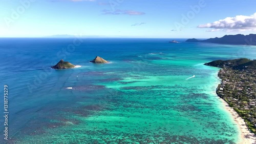 Moke Islands (Mokulua) and Lanikai Beach view from Pillbox Trail hike in Lanikai with Waimanalo in the background