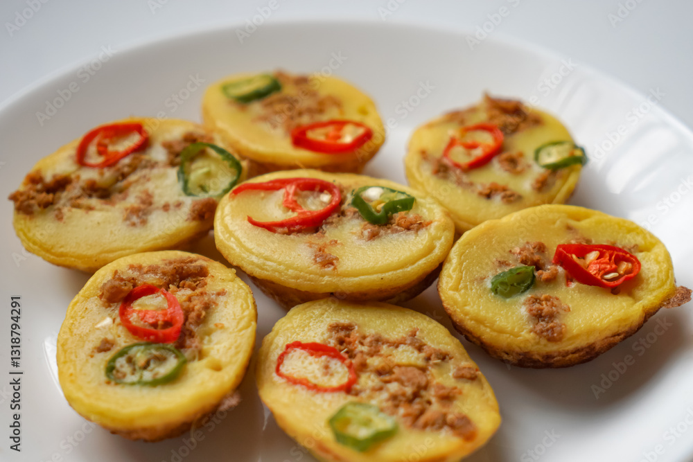 Traditional Malay cake known as Kuih Cara Berlauk. Traditional Malay cake known as Kuih Cara Berlauk.