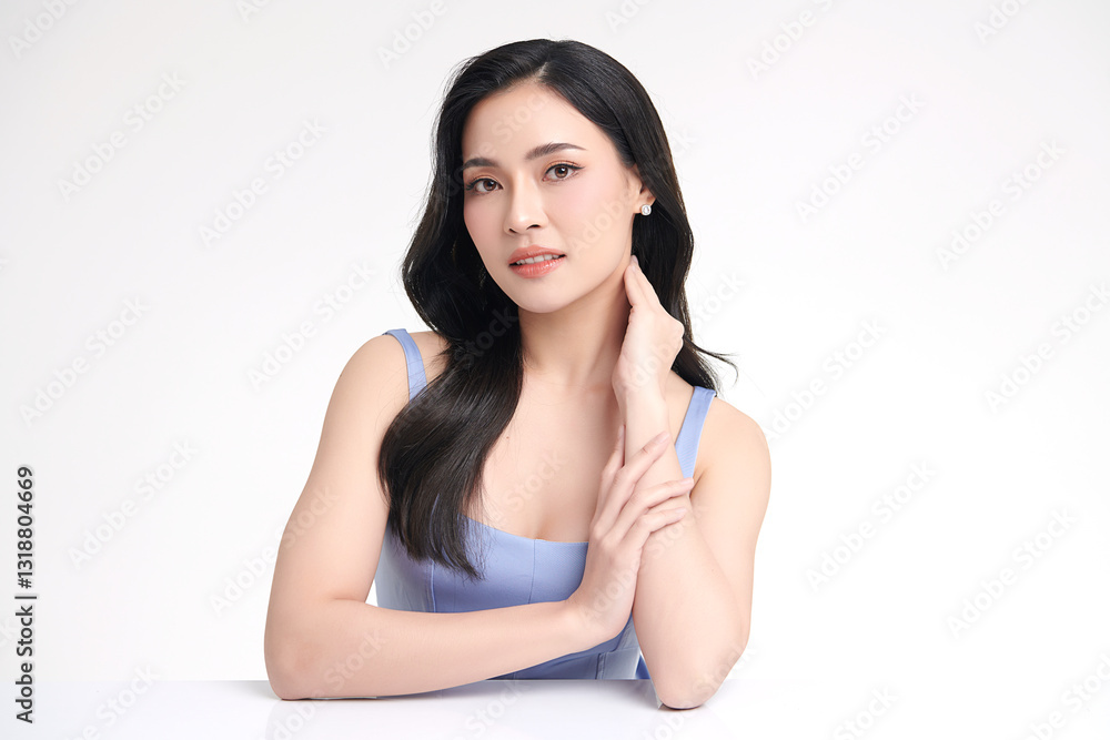 A beautiful young Asian woman with clean, fresh skin against a white background. She represents beauty, skincare, and spa treatments. A beautiful young Asian woman with clean, fresh skin against a white background. She represents beauty, skincare, and spa treatments.
