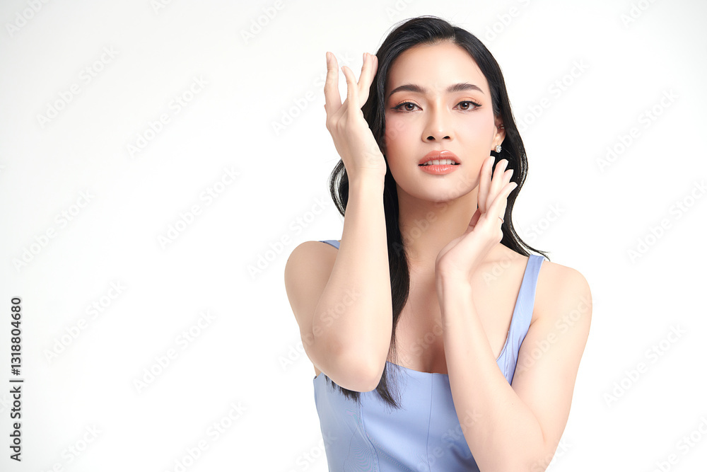 A beautiful young Asian woman with clean, fresh skin against a white background. She represents beauty, skincare, and spa treatments. A beautiful young Asian woman with clean, fresh skin against a white background. She represents beauty, skincare, and spa treatments.