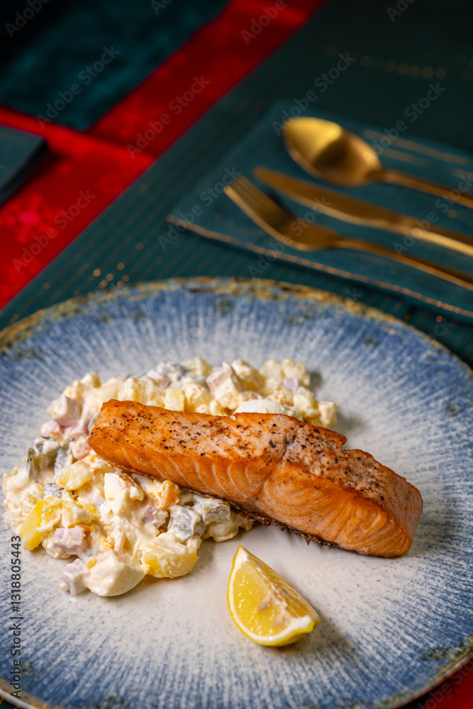 Traditional Christmas dinner in Czech Republic - salmon fillet with potato salad