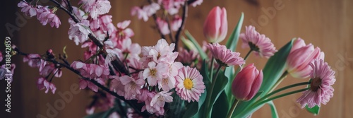 Spring Equinox,Floral Awakening, Pink Spring Flowers on Wooden Background