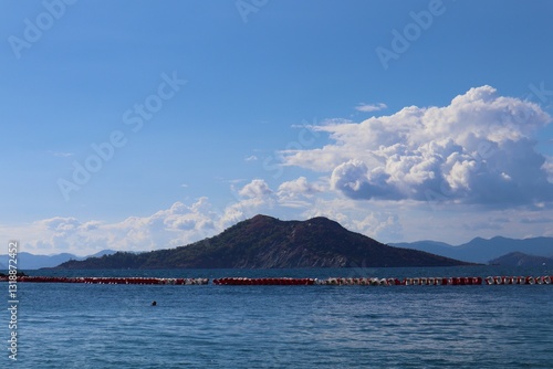 Fototapeta Naklejka Na Ścianę i Meble -  Aegean Sea and costal view near the Dead Sea (Olu Deniz) in Fethiye, Mugla, Turkey.