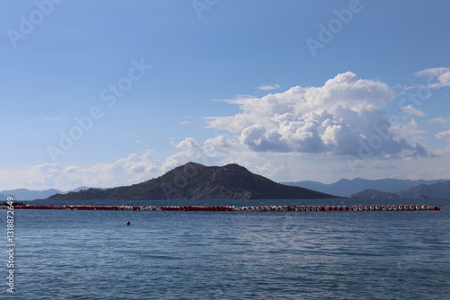 Fototapeta Naklejka Na Ścianę i Meble -  Aegean Sea and costal view near the Dead Sea (Olu Deniz) in Fethiye, Mugla, Turkey.