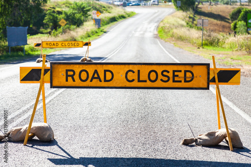 Road closed signs across road