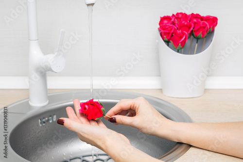 Wallpaper Mural woman washing her hands with flower shaped soap. red rose shaped soap.  Torontodigital.ca