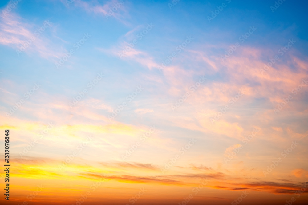 Fototapeta premium Beautiful , luxury soft gradient orange gold clouds and sunlight on the blue sky perfect for the background, take in evening,Twilight, Large size, high definition landscape photo