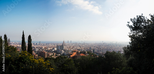 wide sunset panorama of barcelona skyline with blue sky, aerial view