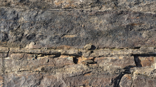 Photography wide format background of stone surface covered with cracks and unevenness