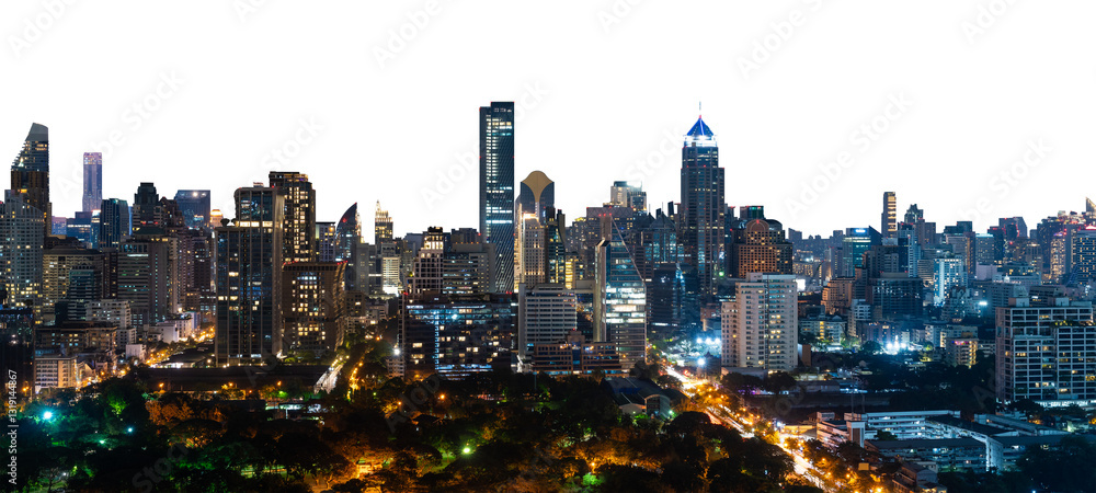 Fototapeta Bangkok skyline at night with illuminated skyscrapers and city lights, isolated on white background. Urban cityscape concept of modern architecture