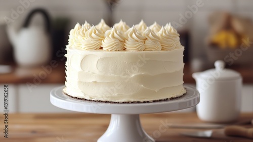 Velvety smooth, creamy frosting envelops a pristine white cake perched on an elegant white pedestal. Delightful swirls and luscious texture invite a sweet indulgence at first glance