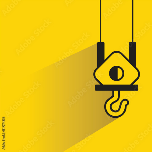 hoist crane hook icon with shadow on yellow background