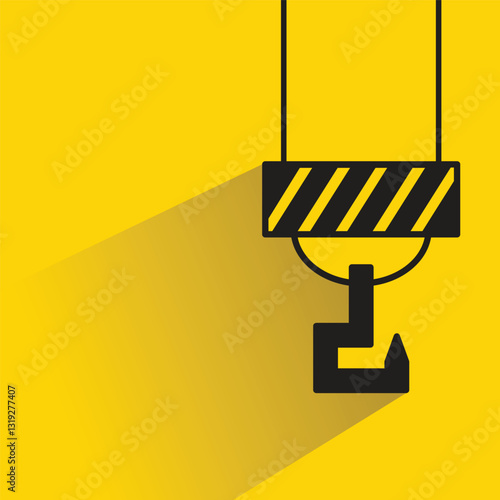 hoist crane hook icon with shadow on yellow background