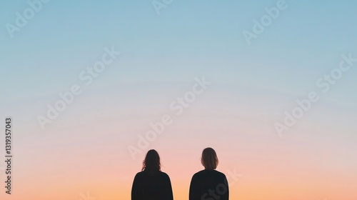 serene landscape with two people standing side by side silhouetted against tranquil sunset backdrop with ample copy