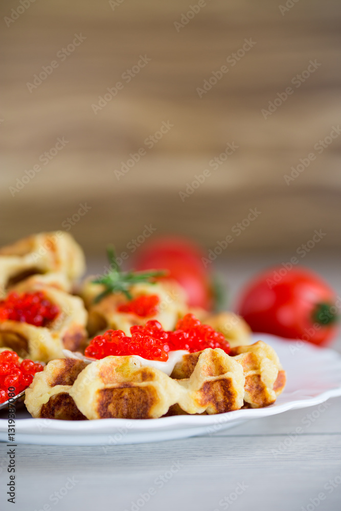 Homemade potato waffles with caviar and herbs for breakfast Homemade potato waffles with caviar and herbs for breakfast
