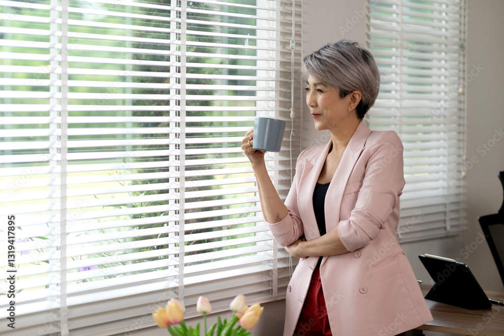 senior businesswoman In casual clothes he is holding a coffee mug senior businesswoman In casual clothes he is holding a coffee mug