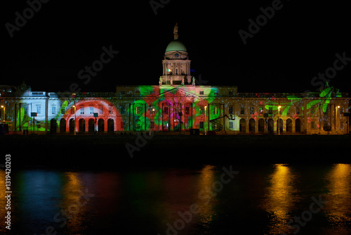 Beautiful static shot of the Custom House building with Christmas projections at night in Dublin. Christmas