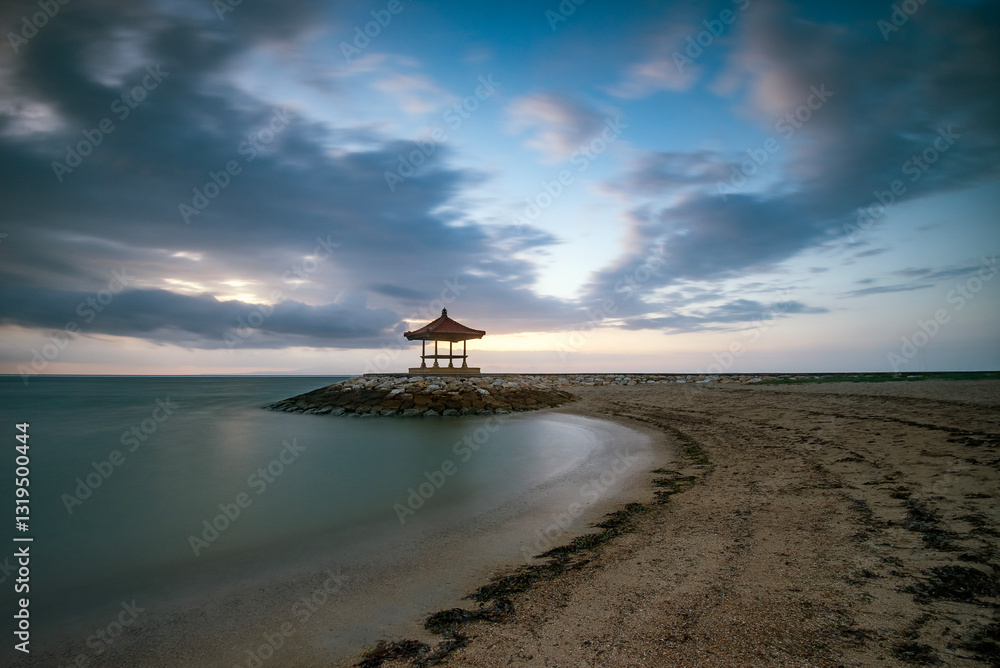 Distant pagoda on Pantai Karang beach at sunset, Sanur, Bali, Indonesia Distant pagoda on Pantai Karang beach at sunset, Sanur, Bali, Indonesia