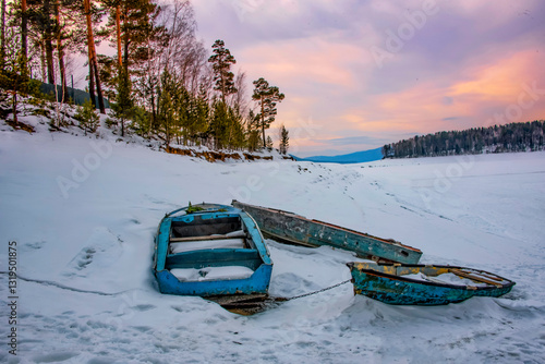Three Wooden boats on the Frozen Yenisei River, Krasnoyarsk, Siberia, Russia