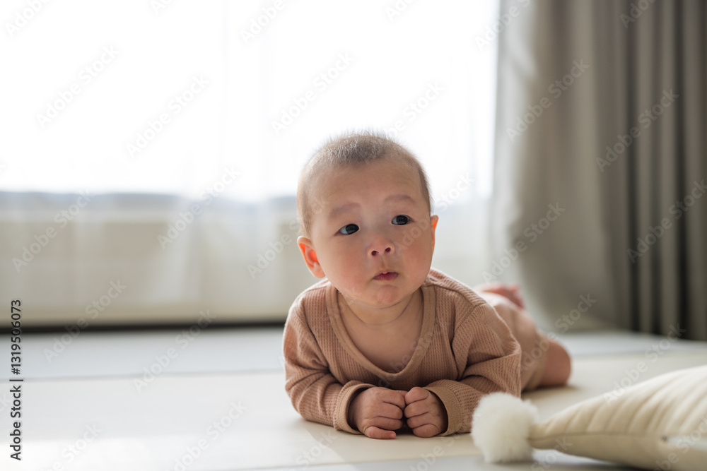 Sweet baby crawling on soft indoor floor Sweet baby crawling on soft indoor floor