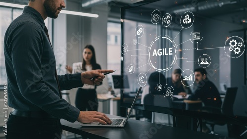 Wallpaper Mural Middle aged man pointing at digital display in modern office with female colleague behind Focus on agile methodology, teamwork, technology Torontodigital.ca