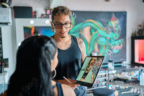 Professional tattoo artist reviewing digital design with client, comparing artistic concepts on tablet in sleek studio setting