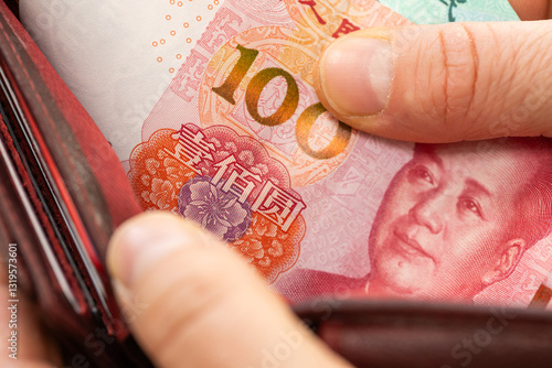 Obraz na płótnie Chinese yuan taken out from wallet, financial concept w salonie